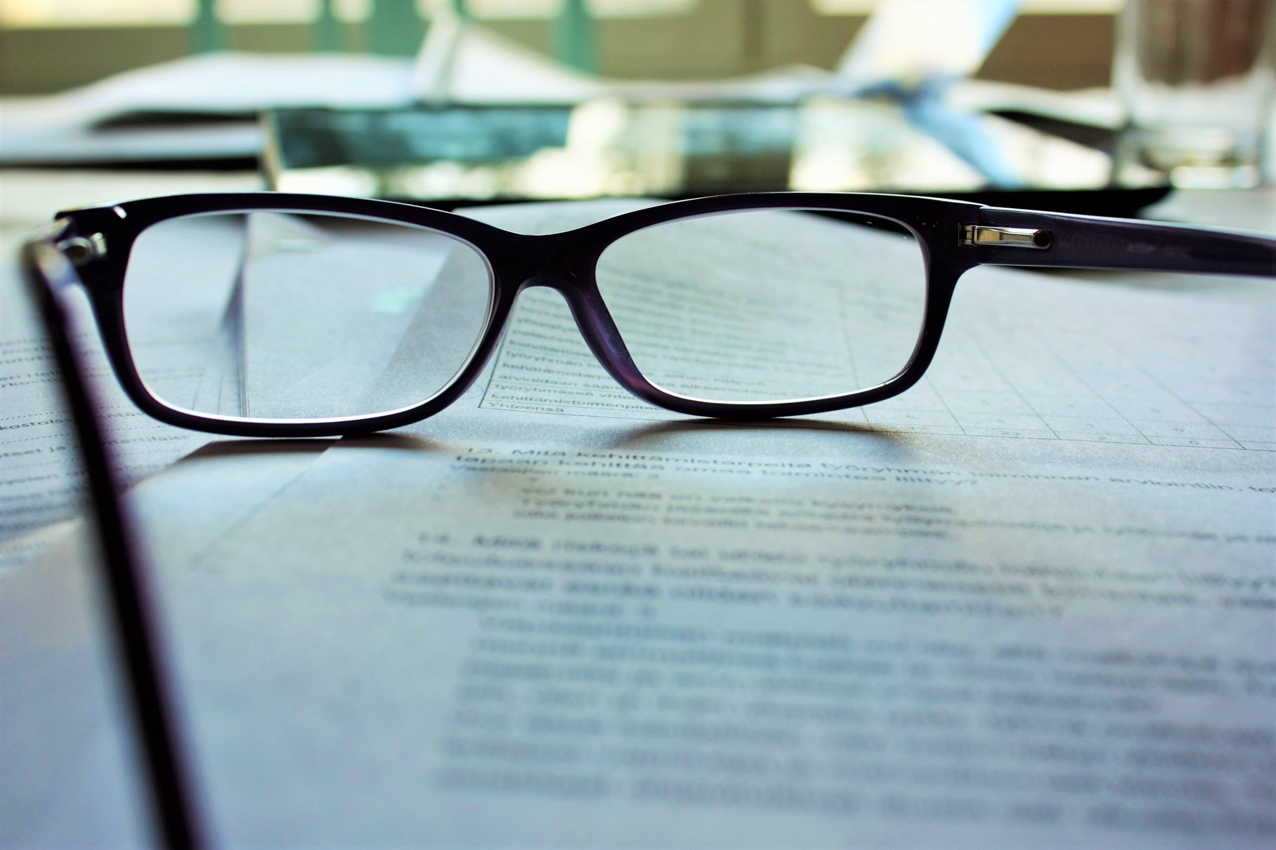 glasses sitting on paper